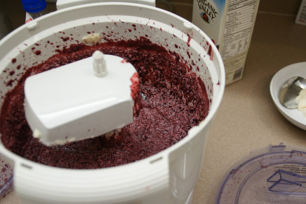 Beets are cooked until tender and then processed in the food processor. Once processed, the beets turn the batter red, but the bundt cakes turn brown when cooked as seen in the photo below.