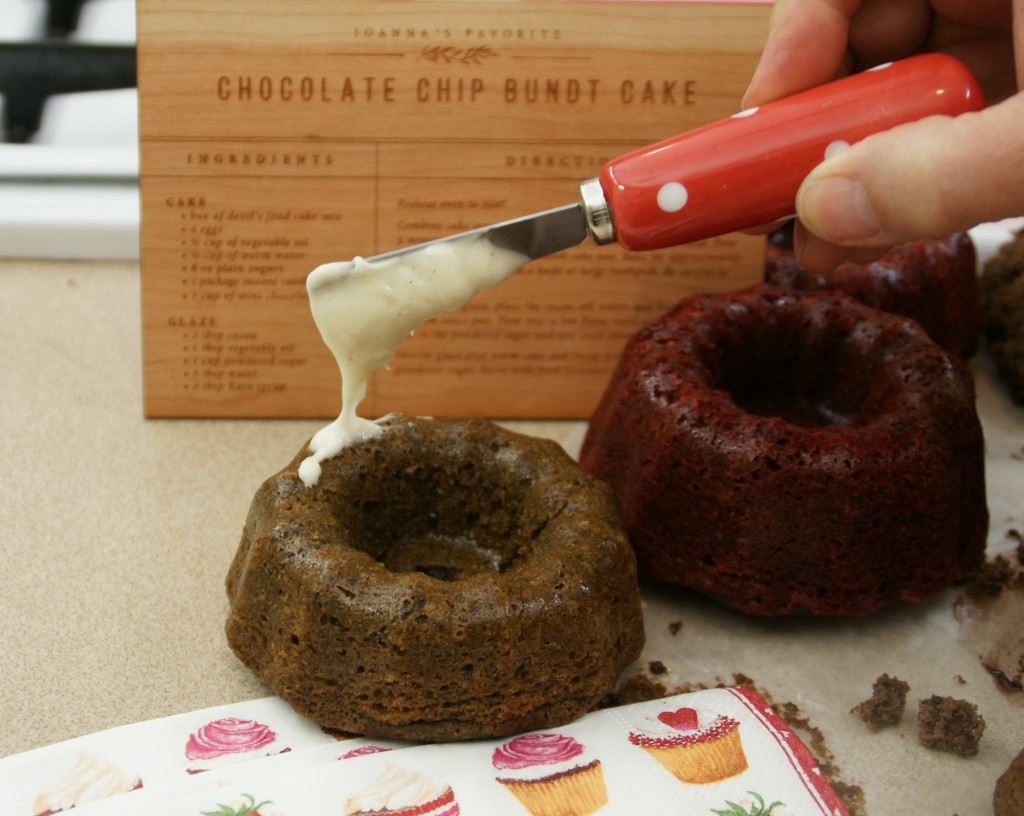 Turn bundt cakes out of the pans within about 10 mintues of when they come out of the oven but let cool completely before frosting or adding a fruit garnish. 